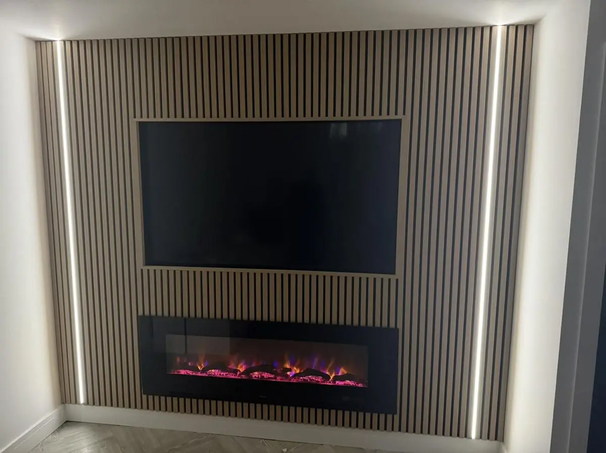 Oak-slat media wall with recessed TV, inset fire and LED lighting