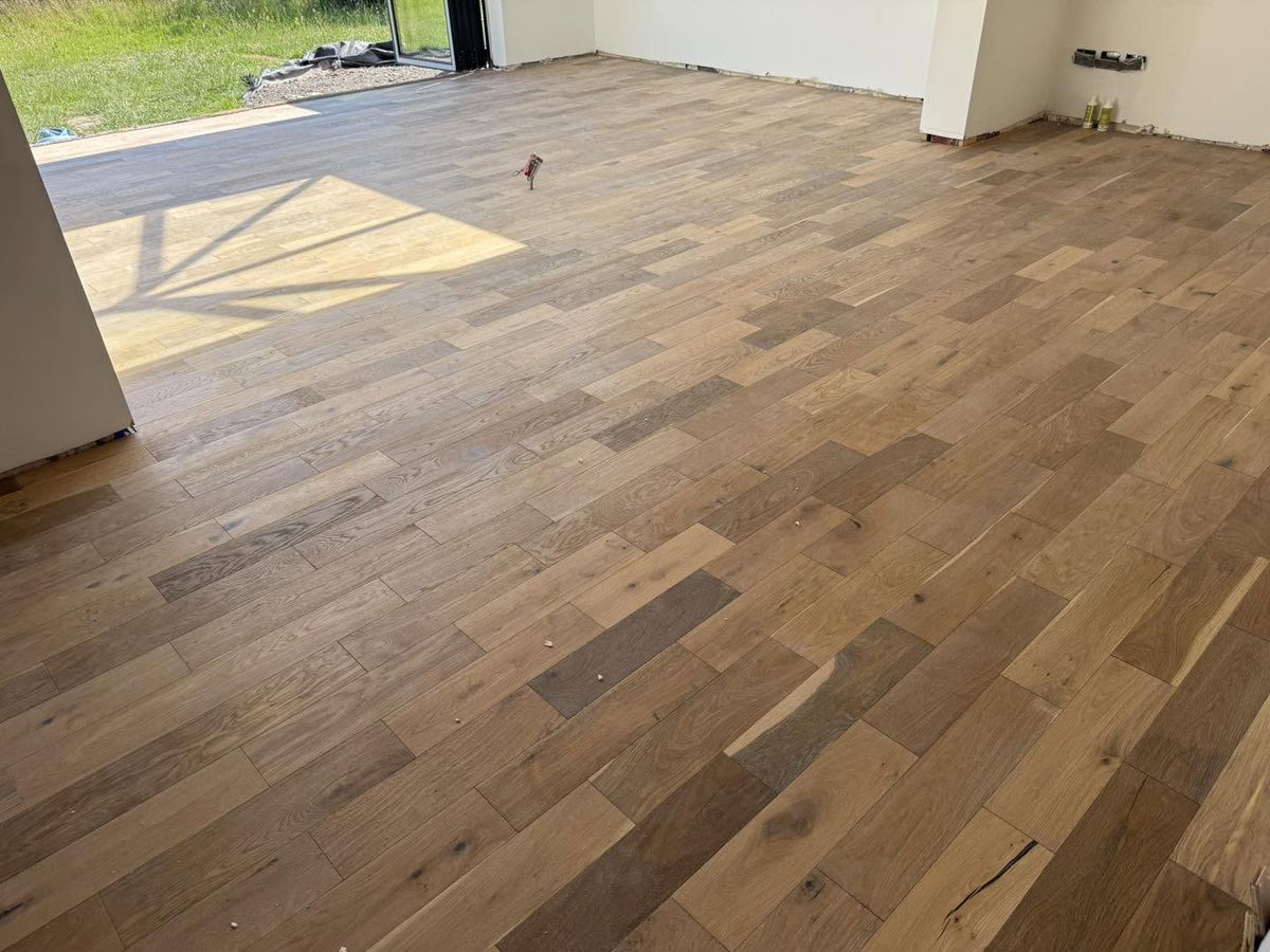 Character-grade solid oak plank flooring in an open-plan room