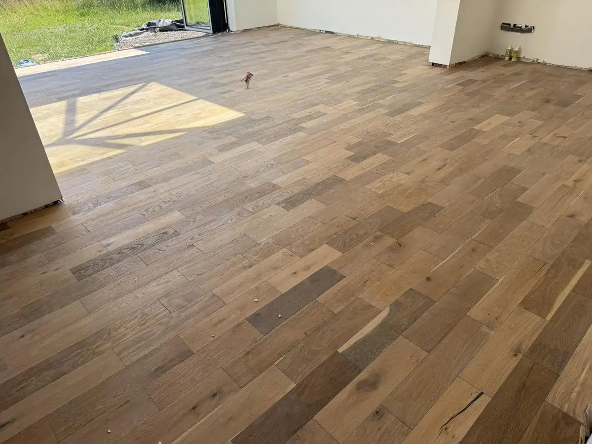 Character-grade solid oak plank flooring in an open-plan room