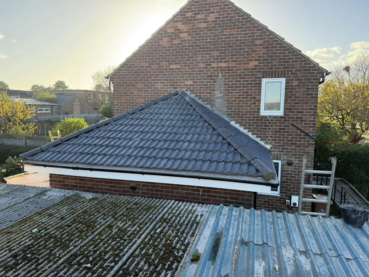 New tiled hip roof on a single-storey extension